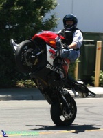 GSXR1000 - Highchair: Stunt rider on a GSXR-1000 riding a highchair wheelie. This GSXR-1000 is very nice and has a crash cage, 12 o'clock bar and Yoshi pipe.